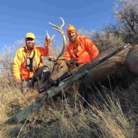hunters with killed elk